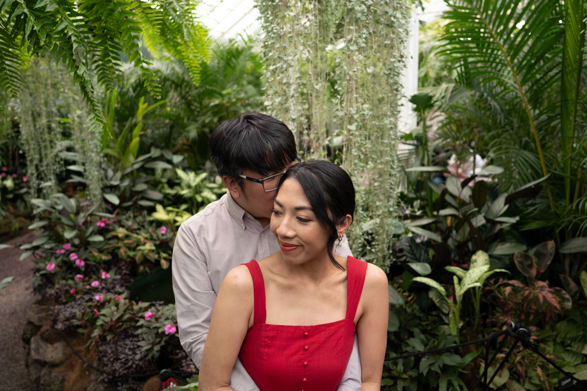 Husband hugging fiancee at the garden